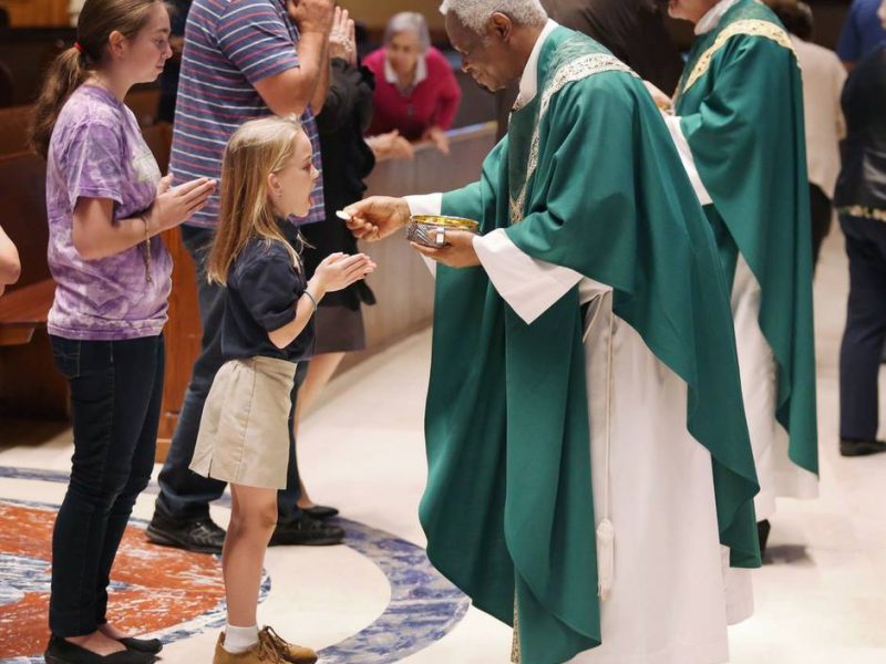 Girl receiving communion
